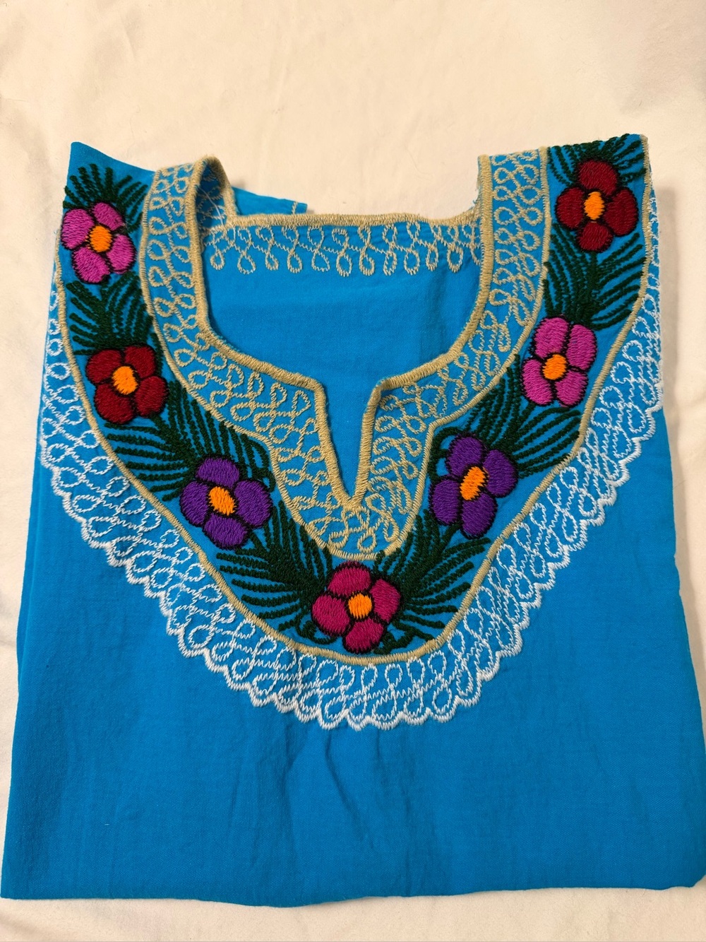Vibrant handmade turquoise with floral neckline top tunic from South America os